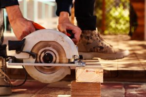 A man using a circular saw