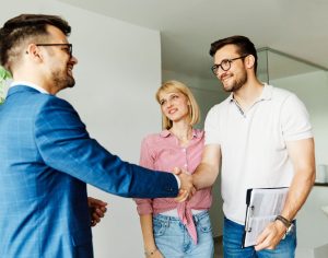 Real estate agent with clients